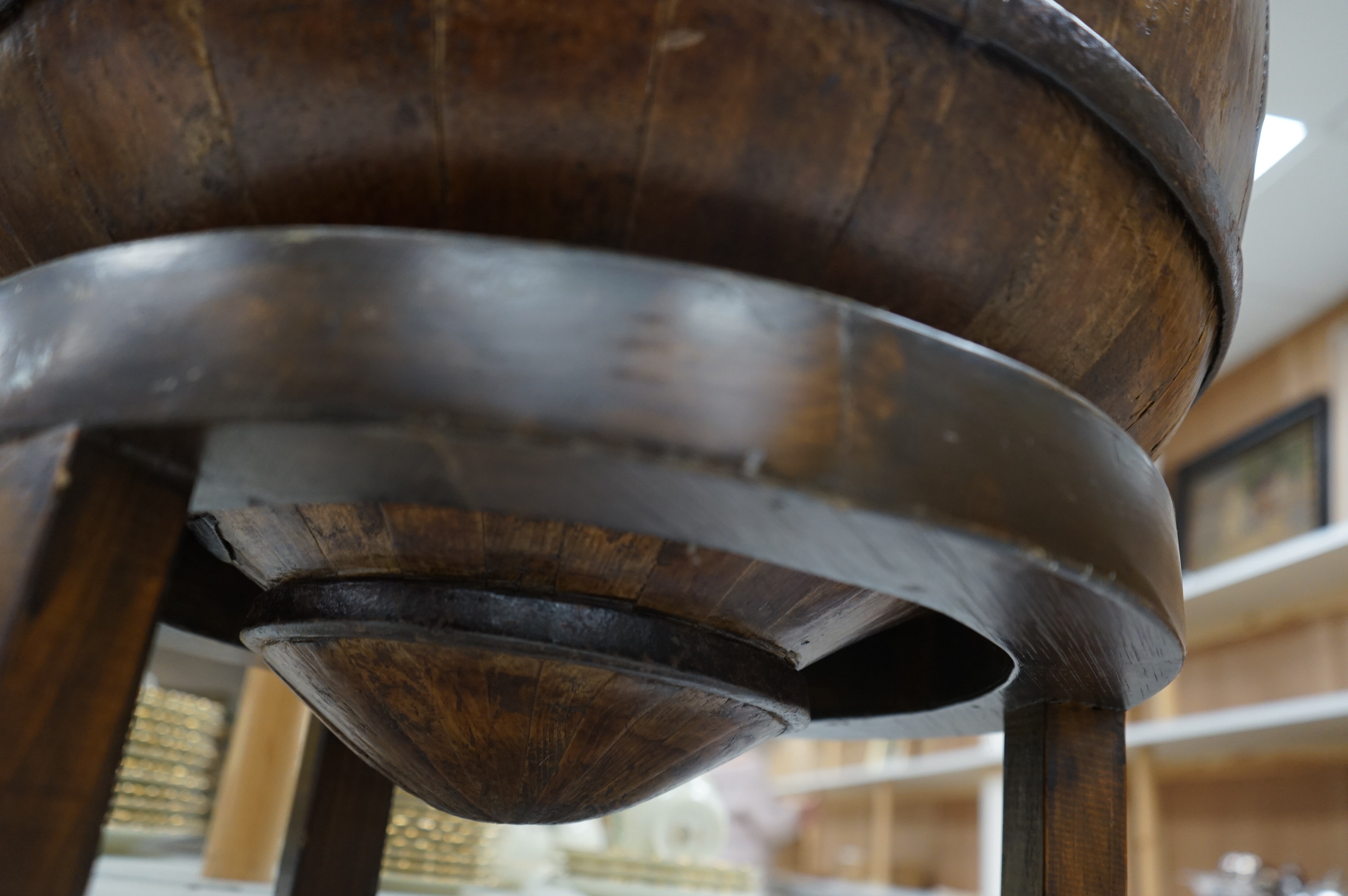 A Chinese wooden and metal bound pail on stand, approximately 55 cm high. Condition - good